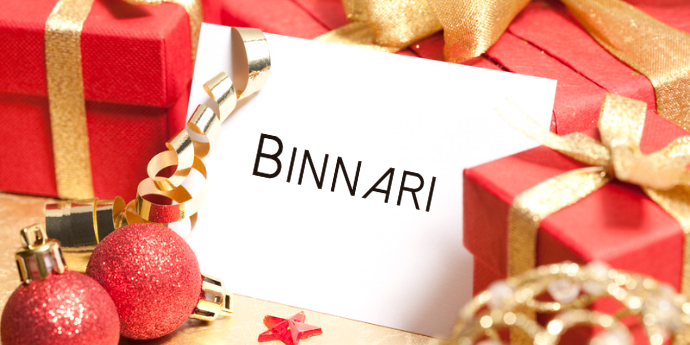 Tarjeta de regalo BINNARI de un bolso para complementar el outfit de Navidad.